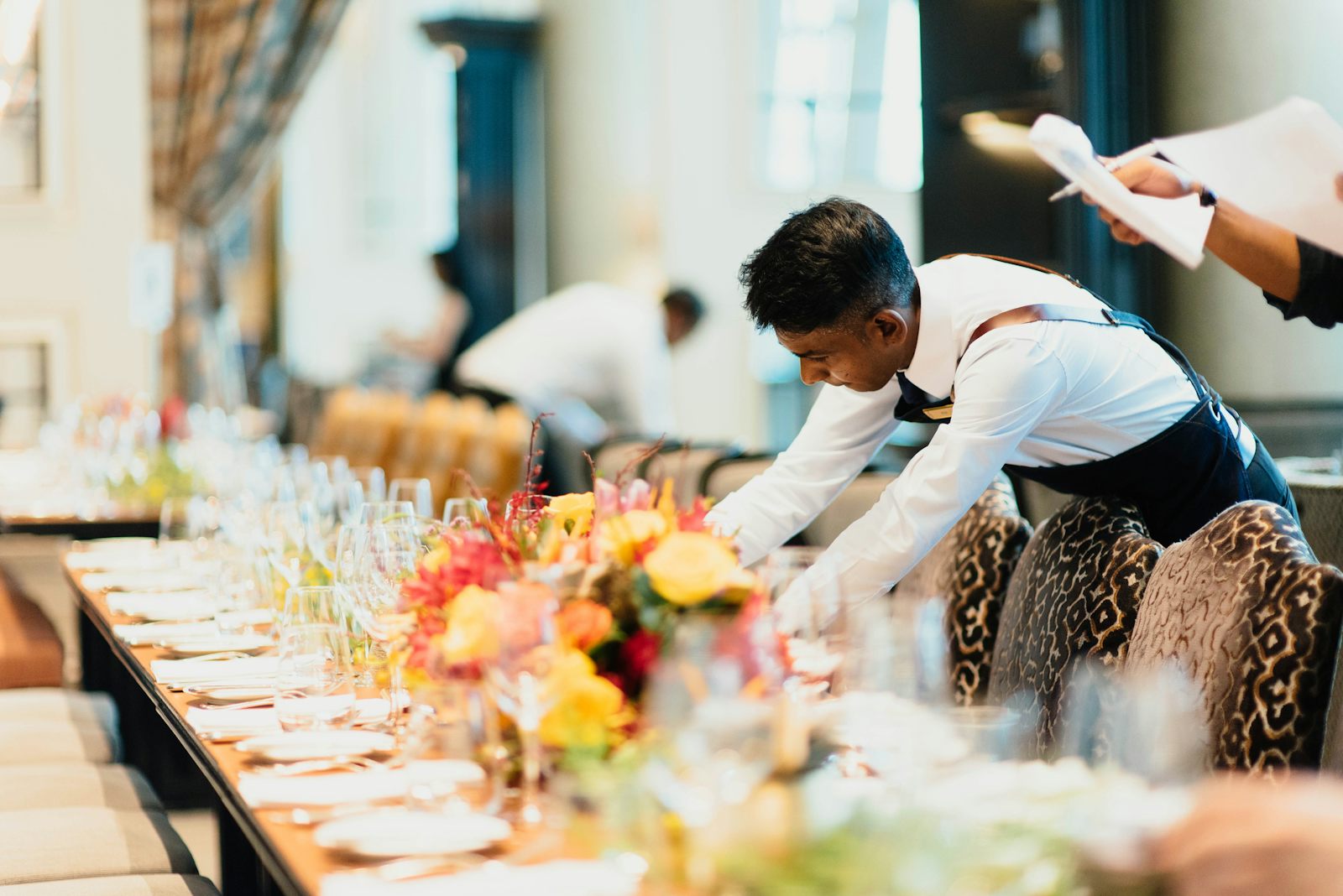 Servers finishing a table